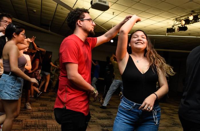 Two students dancing.